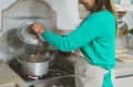 Latin mature woman cooking in old vintage kitchen - Mother preparing lunch at home Royalty Free Stock Photo