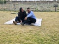 Latin man and woman couple in their 40s without children spends a day of rest having a picnic in a vineyard enjoying quality time