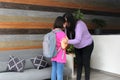 Latin mom with her 10 year old daughter prepare to go back to school with backpack vacations end Royalty Free Stock Photo