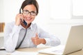 Latin receptionist talking on the phone Royalty Free Stock Photo