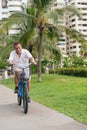 Latin Senior man on park bike ride