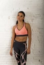 Latin sport woman posing in fierce and badass face expression with fit slim body