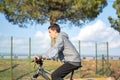 Latin teenage boy with dark hair riding a bike Royalty Free Stock Photo