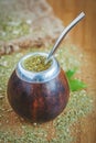 Latin traditional yerba mate tea in calabash with