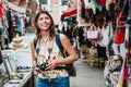 Latin woman backpacker shopping in a Tourist Market in Mexico City, Mexican Traveler in America