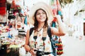 Latin woman backpacker shopping in a Tourist Market in Mexico City, Mexican Traveler in America