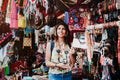 Latin woman backpacker shopping in a Tourist Market in Mexico City, Mexican Traveler in America