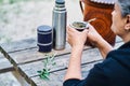 Latin woman drinking mate grass and enjoying a day in the countryside