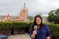 Latin woman drinking rosÃÂ© wine in terrace of san miguel