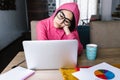 Latin woman in front of her laptop staring at the screen, bored, sleepy, tired in a home office concept in Mexico Latin America Royalty Free Stock Photo