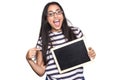 Latin woman holding chalkboard. Royalty Free Stock Photo