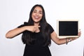 Latin woman holding chalkboard. Royalty Free Stock Photo