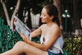 Latin woman holding a map, tourism, travel, leisure, holidays, mexican girl