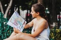 Latin woman holding a map, tourism, travel, leisure, holidays, mexican girl