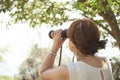 Latin woman looking through binoculars from a viewpoint, El Palmar National Park Royalty Free Stock Photo