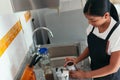 Latin Woman preparing coffee in the kitchen. Conceptual image Royalty Free Stock Photo