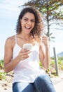 Latin woman receiving good news at phone Royalty Free Stock Photo