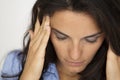 Latin woman suffering from headache