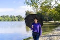 Latin woman with umbrella on a sunny day Royalty Free Stock Photo