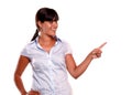 Latin young woman looking and pointing her left Royalty Free Stock Photo