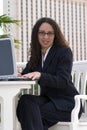 Latina Business Woman with Glasses at Laptop