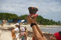 Latina woman with arms raised in a ceremony