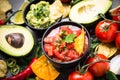 Latinamerican food party sauce guacamole, salsa, chips and ingre Royalty Free Stock Photo