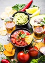 Latinamerican food party sauce guacamole, salsa, chips and tequi Royalty Free Stock Photo