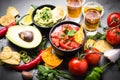 Latinamerican food party sauce guacamole, salsa, chips and tequi Royalty Free Stock Photo