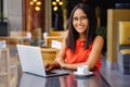 Latinamerican girl have a coffee break in a cafe