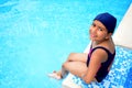Latinamerican girl in the swimming pool. Royalty Free Stock Photo