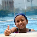 Latinamerican girl in the swimming pool. Royalty Free Stock Photo