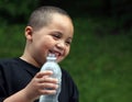 Latino boy with bottle Royalty Free Stock Photo