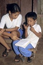 Latino boy and teacher during arithmetic lesson Royalty Free Stock Photo