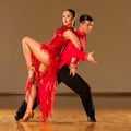 Latino dance couple in action - dancing wild samba