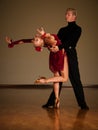 Latino dance couple in action preforming a exhibition dance - w Royalty Free Stock Photo