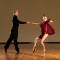 Latino dance couple in action preforming a exhibition dance - w Royalty Free Stock Photo