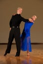 Latino dance couple in action preforming a exhibition dance - wild samba Royalty Free Stock Photo