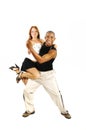 Latino dance instructor carrying girl