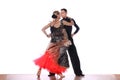 Latino dancers in ballroom against white background Royalty Free Stock Photo