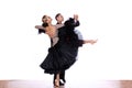 Latino dancers in ballroom against white background Royalty Free Stock Photo