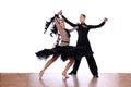 Latino dancers in ballroom against white background Royalty Free Stock Photo