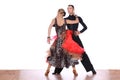 Latino dancers in ballroom against white background Royalty Free Stock Photo