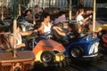 Latino family in bumper cars Royalty Free Stock Photo