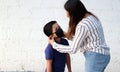 Latino family, mom and 6-year-old Latino boy with covid-19 protection mask, back to school with a new normal Royalty Free Stock Photo