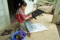 Latino Indian woman weaving on hand loom