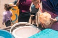 Latino man putting a straw in a peeled coconut on the beach in Masachapa Nicaragua. Concept of summer vacations and self