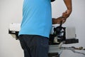 Latino man repairs air conditioning Royalty Free Stock Photo