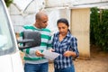 Man and woman farmers talking near car Royalty Free Stock Photo