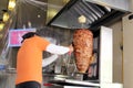 Latino man working on typical Mexican food, pork in tropo and pastor tacos